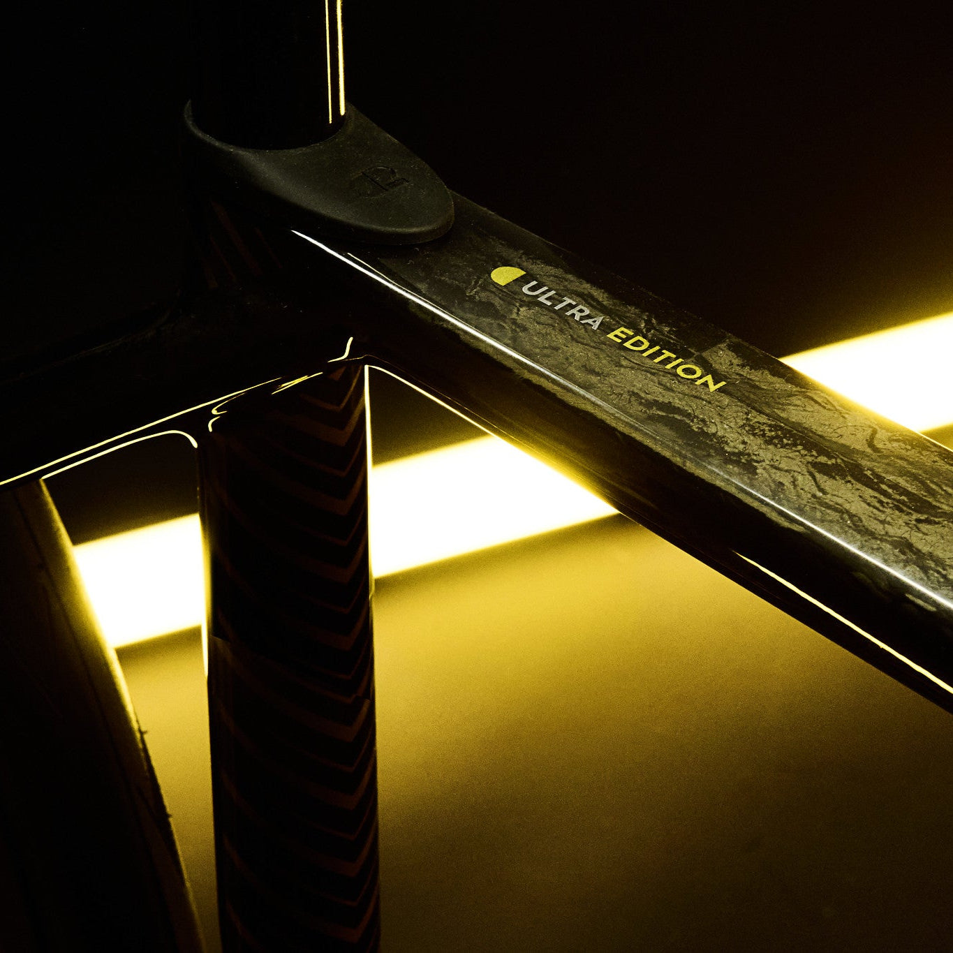 Close-up of a car spoiler with 'Ultra Edition' branding on a reflective surface.